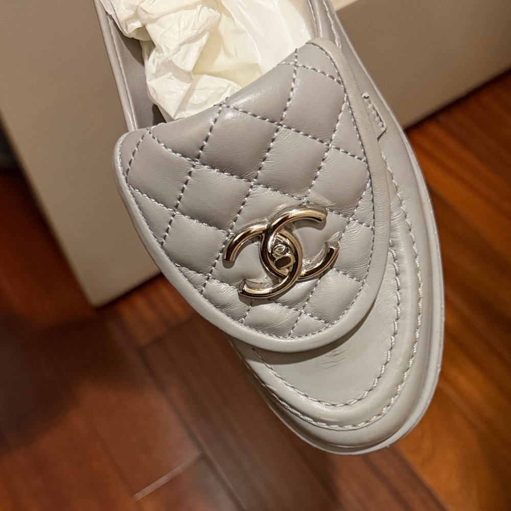CHANEL Quilted Leather Loafers in Light Gray with Gold Logo